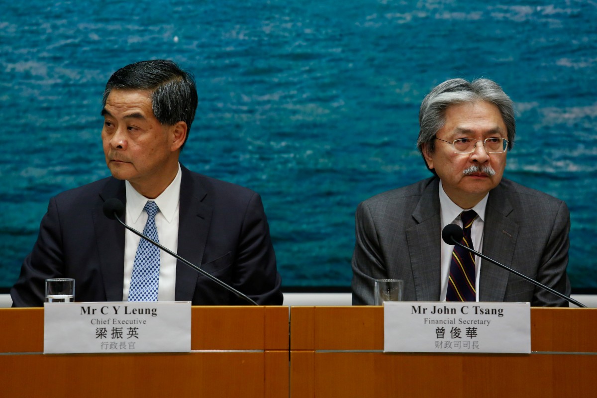 Hong Kong Chief Executive Leung Chun-ying and Financial Secretary John Tsang attend a news conference in Hong Kong