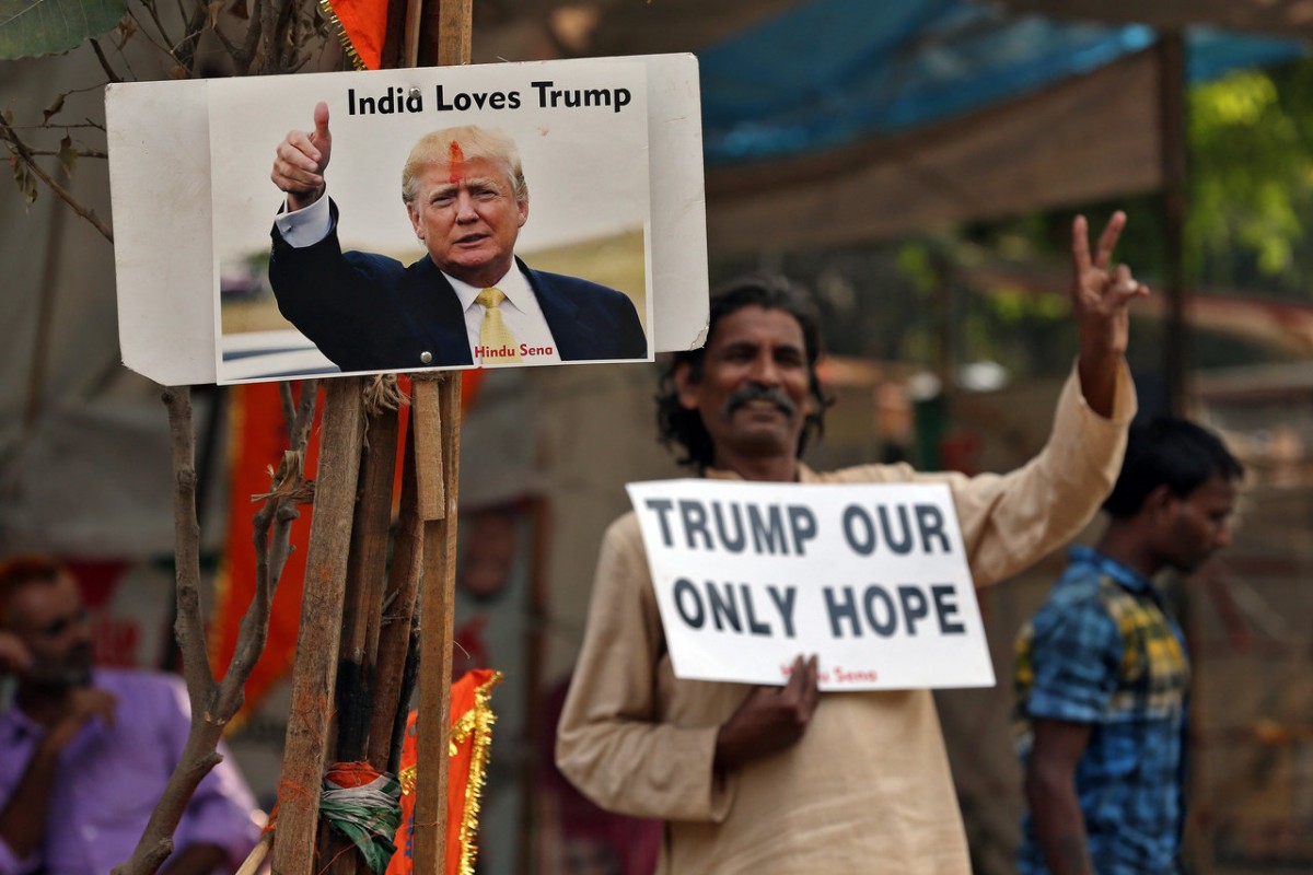 A member of Hindu Sena, a right-wing Hindu group, celebrate Republican presidential nominee Donald Trump's victory in the U.S. elections, in New Delhi, India, November 9, 2016. REUTERS/Cathal McNaughton