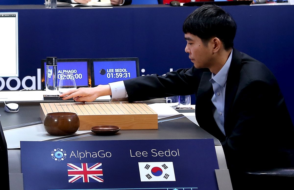 The world's top Go player Lee Sedol puts the first stone against Google's artificial intelligence program AlphaGo