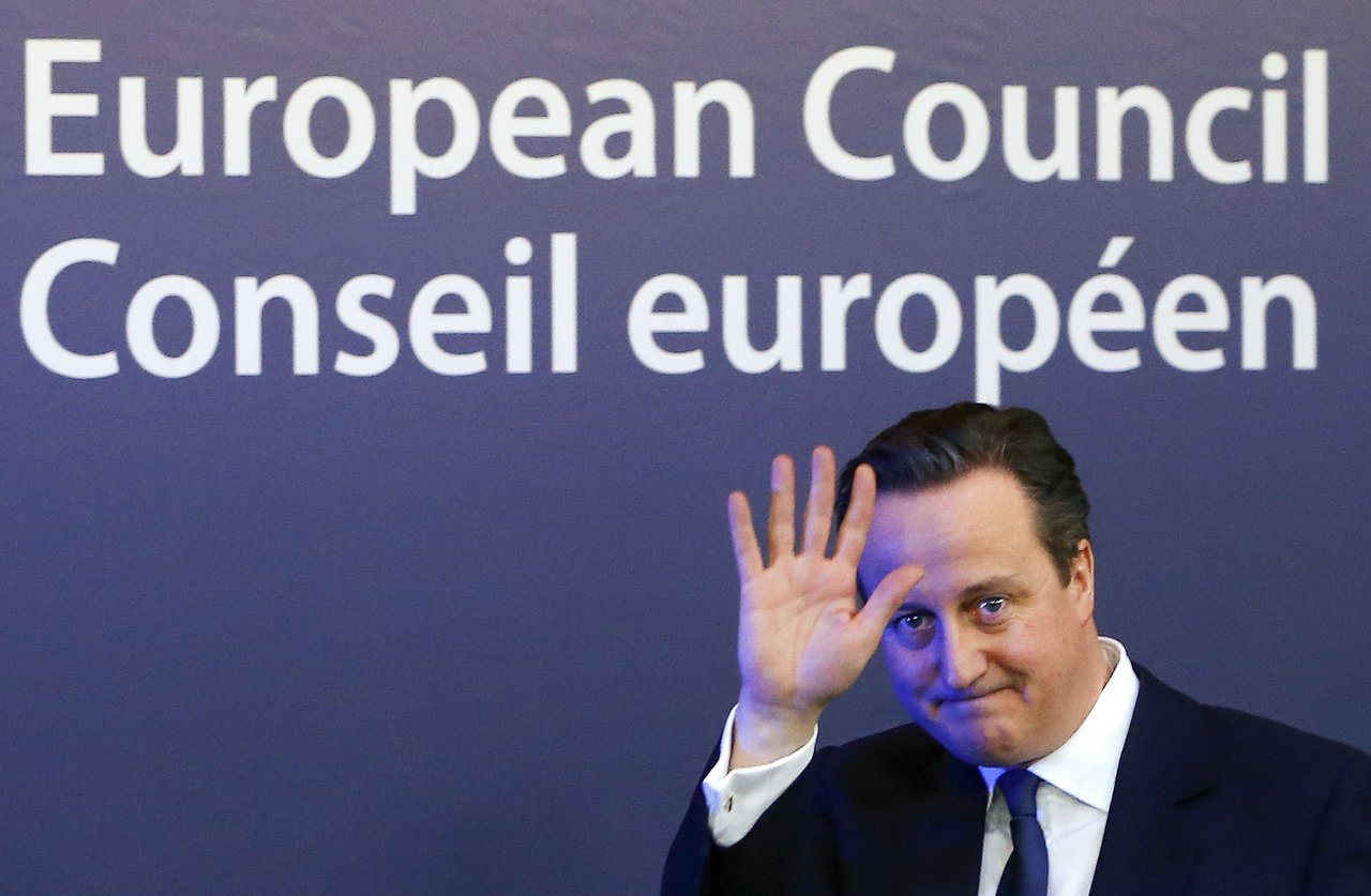 British Prime Minister David Cameron waves as he leaves a European Union leaders summit in Brussels February 20, 2016. Cameron said on Friday he would campaign with all his "heart and soul" for Britain to stay in the European Union after he won a deal about the so-called Brexit, in Brussels which offered his country "special status". REUTERS/Yves Herman