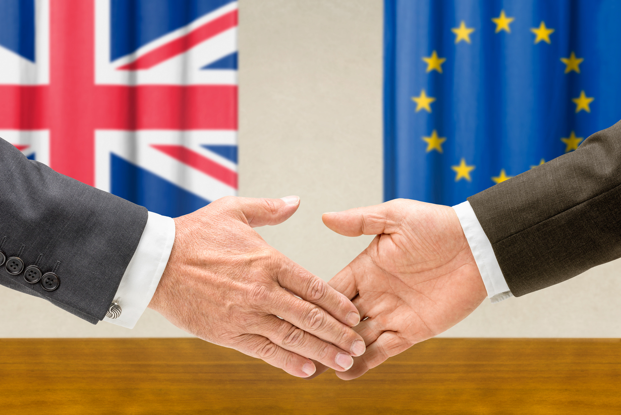 Representatives of the UK and the EU shake hands